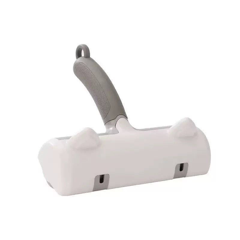 Dr. Milou Milou & Lumi reusable pet lint roller with handle and sticky surface for removing pet hair from clothing and furniture.