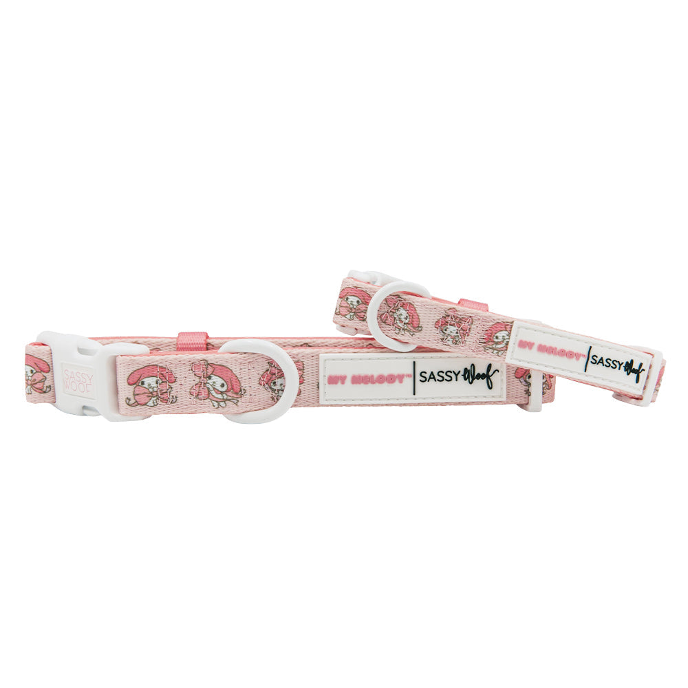 Sassy Woof My Melody™ dog collar featuring colorful My Melody and Hello Kitty design on a pink background.