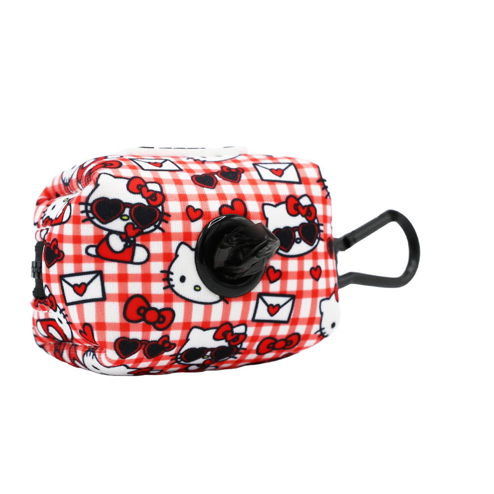 Red Hello Kitty pet waste bag holder by Sassy Woof, designed for convenient dog waste disposal and carrying accessories.