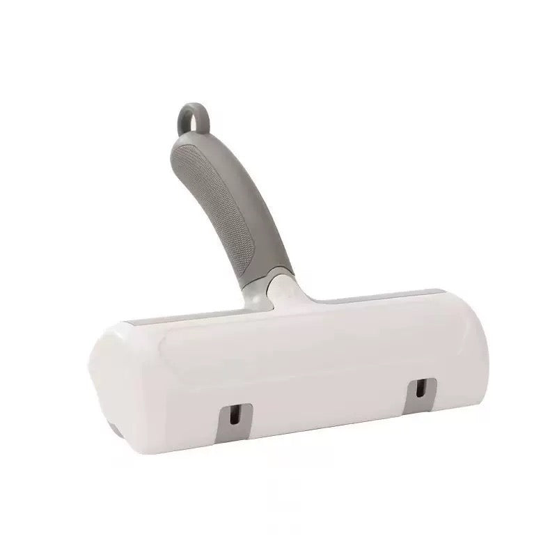 Dr. Milou Milou & Lumi reusable pet lint roller with handle and roller sheets in use for removing pet hair from clothing.