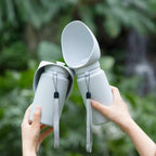 Portable collapsible pet water bottle by Dr. Milou, featuring a compact design with a built-in water dish for pets on the go.