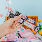 Pink dog collar featuring Hello Kitty® and friends with a colorful flower festival design, by Sassy Woof.
