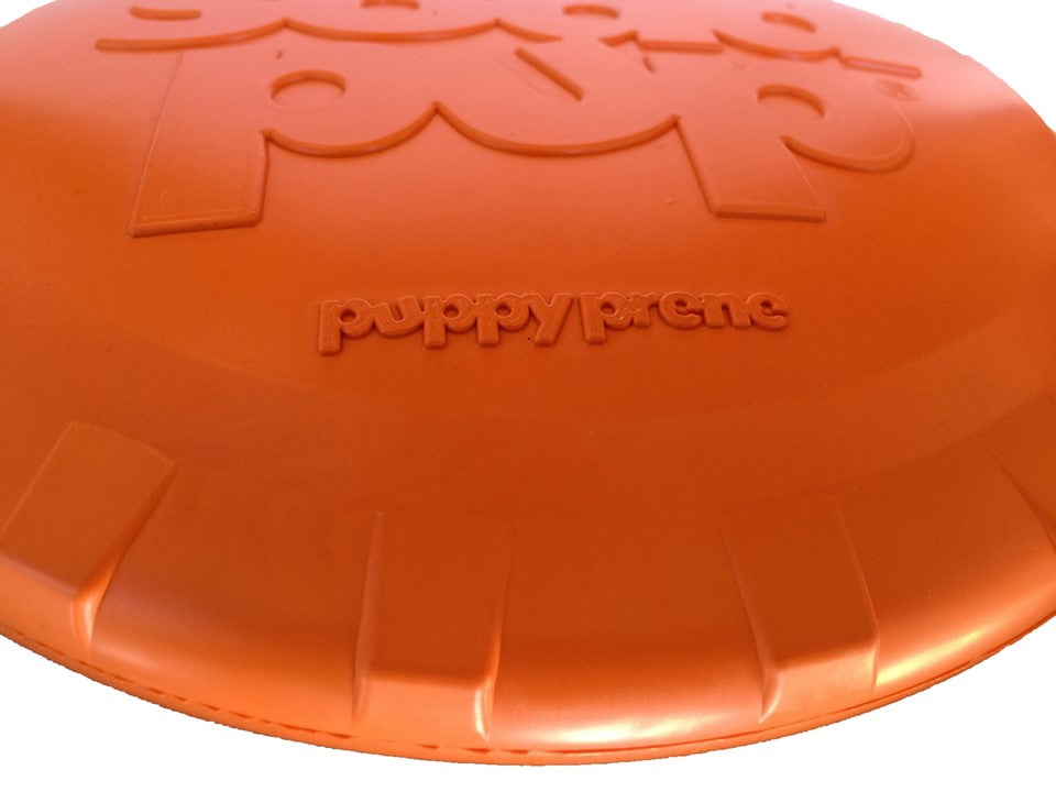 Orange rubber dog frisbee toy by SodaPup, vet-approved, USA-made Bottle Top Flyer ideal for dogs to fetch and chew.