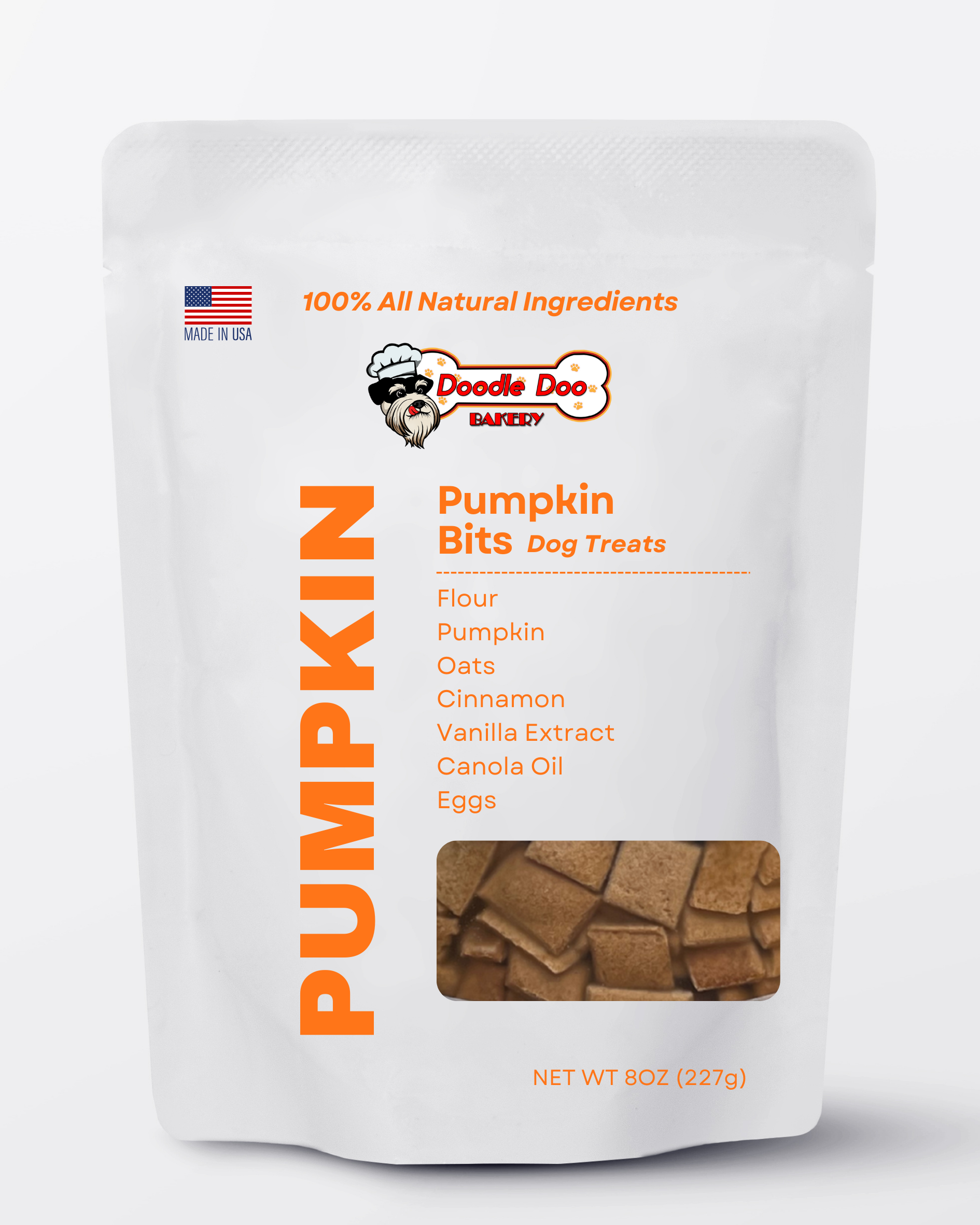 Homemade Pumpkin Bits Dog Treats by Doodle Doo Bakery, 1/2lb, showing crunchy pumpkin-shaped biscuits for dogs.