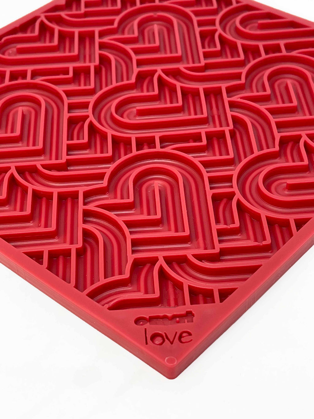 Love eMat enrichment lick mat for dogs and cats with a heart design, made by SodaPup, for interactive pet feeding and bonding.